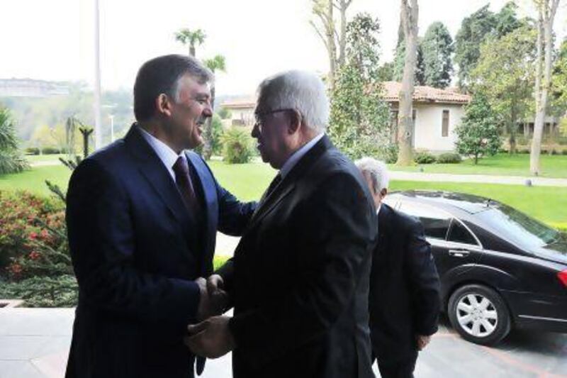 Turkey's President Abdullah Gul, left, welcomes Palestinian President Mahmoud Abbas before their meeting in Istanbul.