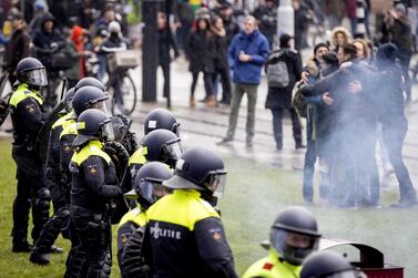 Protesters clash with riot police during the anti government protest on the Museumplein, in Amsterdam, The Netherlands, 17 January 2021. EPA