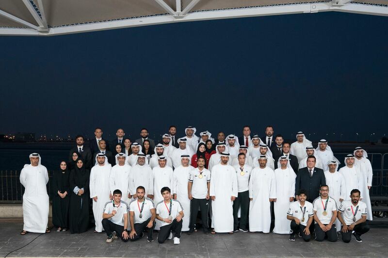 ABU DHABI, UNITED ARAB EMIRATES - September 10, 2018:  HH Sheikh Mohamed bin Zayed Al Nahyan, Crown Prince of Abu Dhabi and Deputy Supreme Commander of the UAE Armed Forces (2nd row 10th L), stands for a photograph with the 18th Asian Games Jiu Jitsu participants, during a Sea Palace barza. Seen with HE Abdulmunam Al Hashemi, Chairman of the UAE Jiu-Jitsu Federation (2nd row L) and HE Mohamed Salem Al Dhaheri, Executive Director of School Operations, Abu Dhabi Education Council (ADEC) (2nd row 12th L).

( Mohamed Al Hammadi / Crown Prince Court - Abu Dhabi )
---