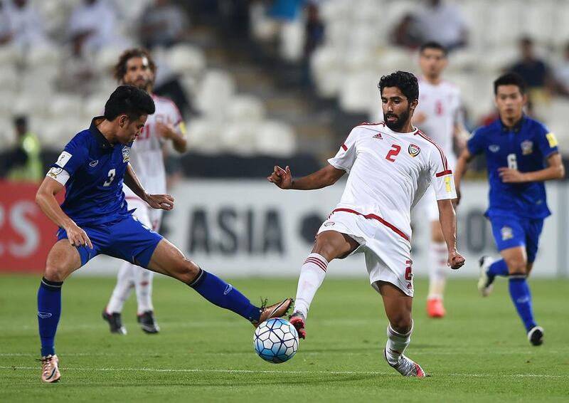 Salem Saleh of UAE and Theerathon Bunmathan of Thailand battle for the ball. Tom Dulat / Getty Images