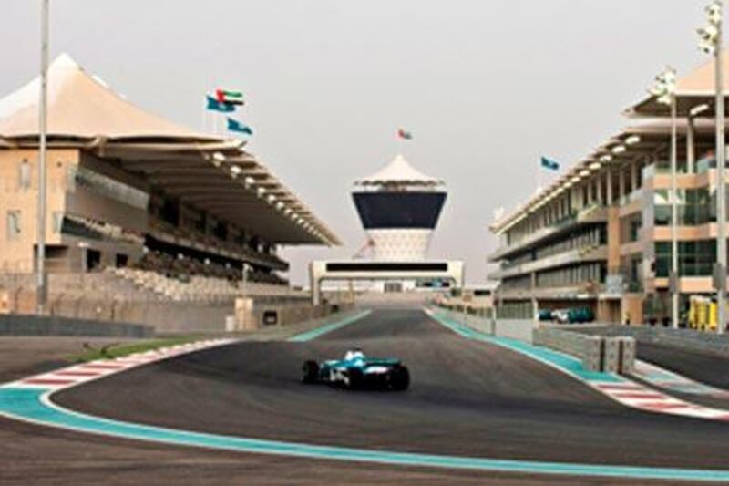 A Formula One car speeds around around the Yas Marina circuit, in Abu Dhabi.