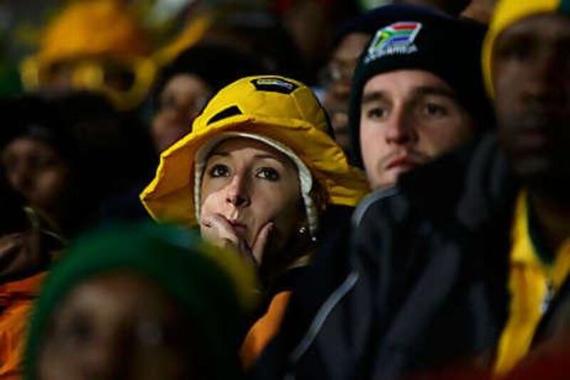 South Africa fans show their disappointment after their team conceded a goal against Uruguay.