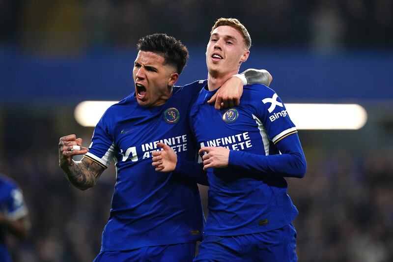 Cole Palmer celebrates with Enzo Fernandez after scoring Chelsea's second goal against Newcastle during the Premier League match at Stamford Bridge, London. PA