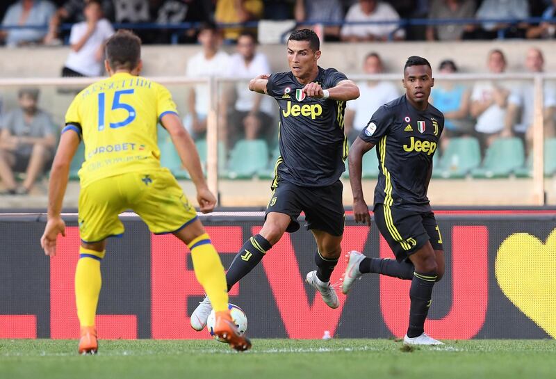 Cristiano Ronaldo in action with Chievo's Luca Rossettini. Reuters