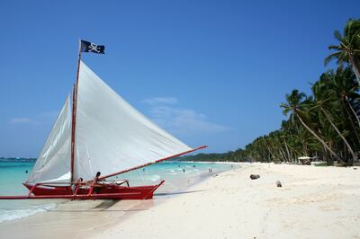 paraw sailboat on white sand beaches of boracay island in the philippines (iStockphoto.com)