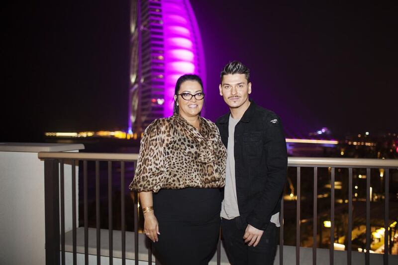 Rea Ann Silva, the founder of beauty blender with celebrity make-up artist, Mario Dedivanovic, in front of the Burj Al Arab in Dubai. Courtesy Anna Nielsen for The National


