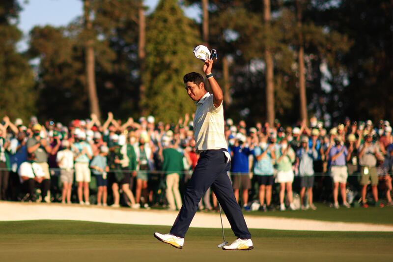 Hideki Matsuyama of Japan celebrates on the 18th green after winning the Masters at Augusta National Golf Club. AFP