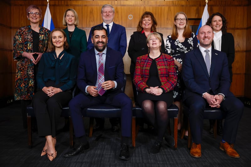 Mr Yousaf and his new cabinet pose at St Andrew's House in Edinburgh, in February. Getty Images