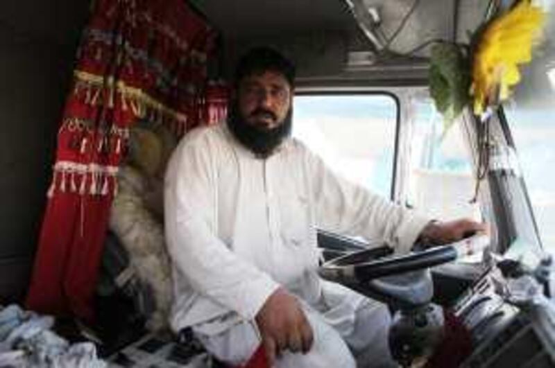 United Arab Emirates - Abu Dhabi - September 17 - Sareen Dalkhan, a truck driver, waits for gas at a station in Mussaffa .  (Galen Clarke/The National)  *** Local Caption ***  GC07_09172009_Truckers.JPG