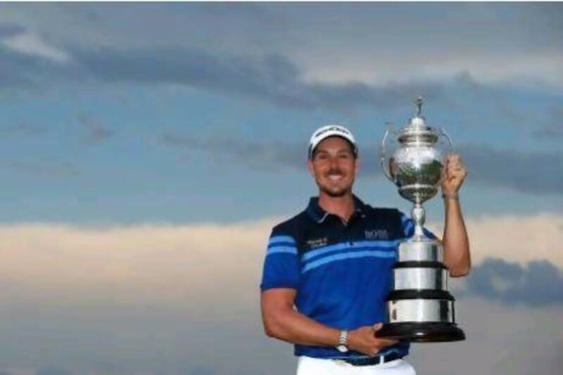JOHANNESBURG, SOUTH AFRICA - NOVEMBER 18: Henrik Stenson of Sweden poses with the trophy after securing victory in the final round of the South African Open Championship at the Serengeti Golf Club on November 18, 2012 in Johannesburg, South Africa. (Photo by Richard Heathcote/Getty Images) *** Local Caption *** 156655069.jpg
