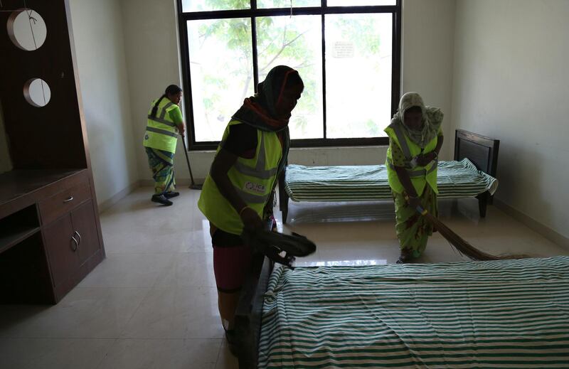 Indian municipal workers prepare a room to be used as isolation ward in Hyderabad. AP Photo