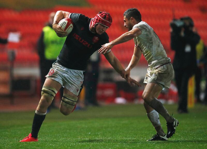 Wales' James Botham takes on Georgia's Tedo Abzhandadze. Reuters