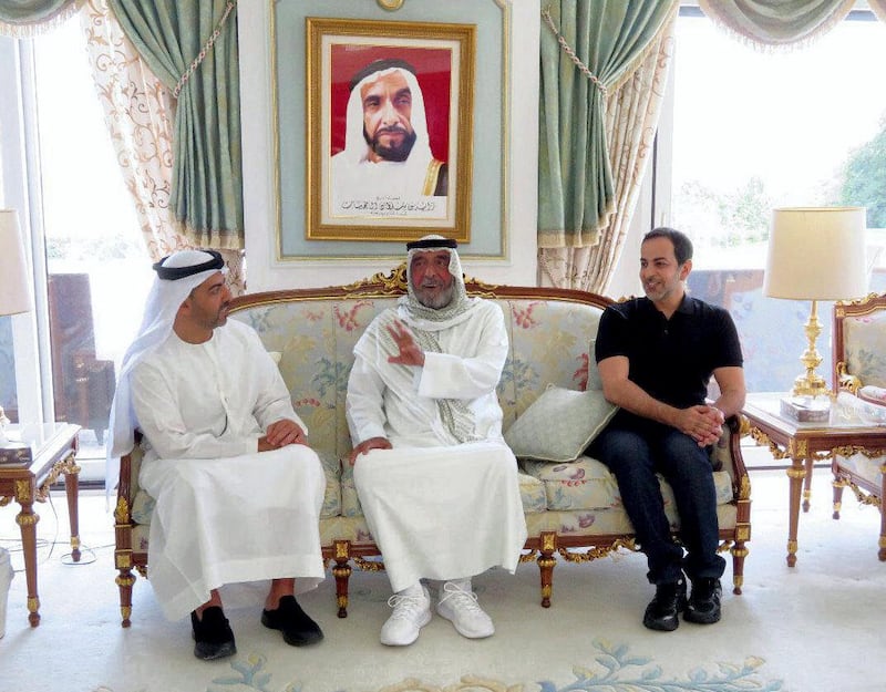 A handout picture released by the United Arab Emirates News Agency WAM on June 10, 2018,  shows UAE President Sheikh Khalifa bin Zayed Al-Nahyan (C) meeting with family members at his residence in the French resort town of Evian, one of his rare appearances since a stroke in 2014. - The official news agency published photos of white-bearded Abu Dhabi Emir Sheikh Khalifa, 70, chatting with relatives (Photo by Handout / WAM / AFP)