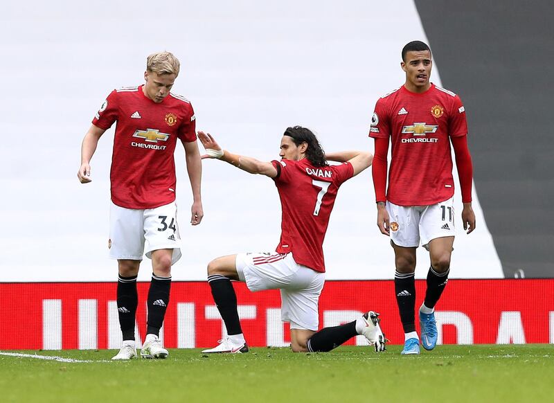 Edinson Cavani, centre, celebrates scoring United's third goal. PA