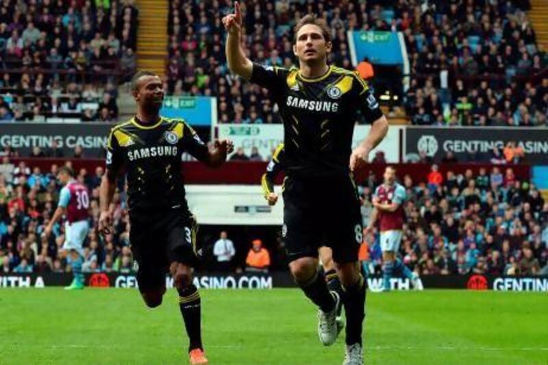Frank Lampard celebrates scoring his and Chelsea's first goal against Aston Vill. Paul Ellis / AFP