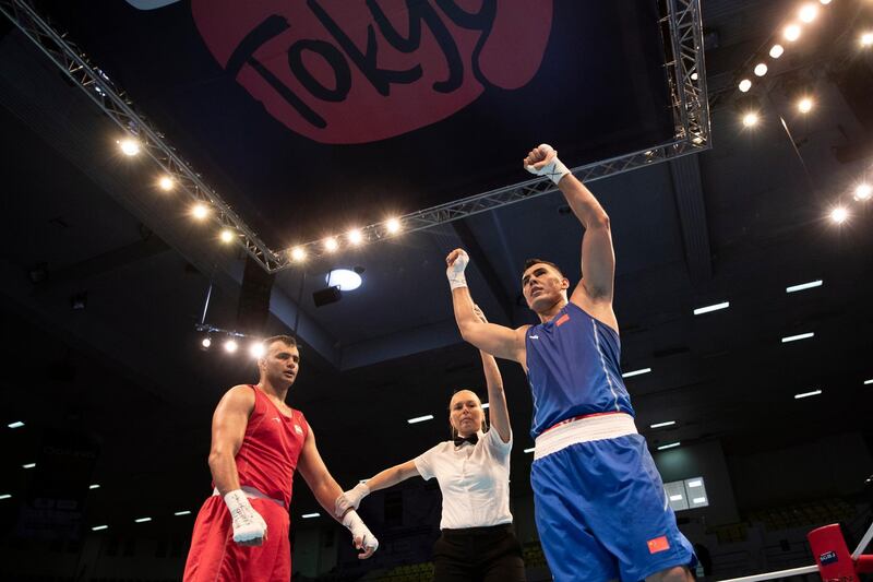 Iman Ramezanpoudelavari from Iran loses his men's Welterweight bout with Maimaiti Aihemaiti from China at the Tokyo 2020 Olympic boxing qualifiers tournament in Amman, Jordan.  EPA