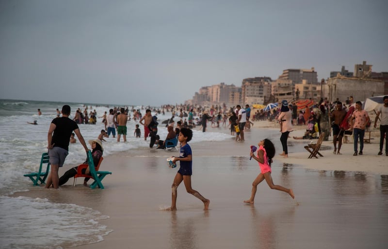 Egyptians spend their time at a beach near Alexandria. EPA