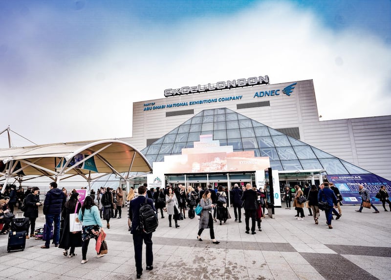 World Travel Market London 2019, ExCeL London - Visitors arrive on day 2, Tuesday, at the west entrance to the sound of a busker playing a trombone