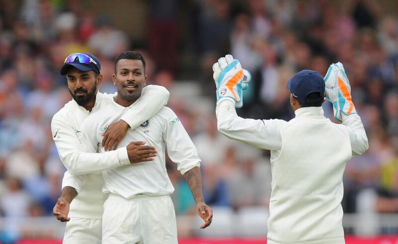 India's Lokesh Rahul, left, and Rishabh Pant congratulate Hardik Pandya, center, for the dismissal of England's Stuart Broad during the second day of the third cricket test match between England and India at Trent Bridge in Nottingham, England, Sunday, Aug. 19, 2018. (AP Photo/Rui Vieira)