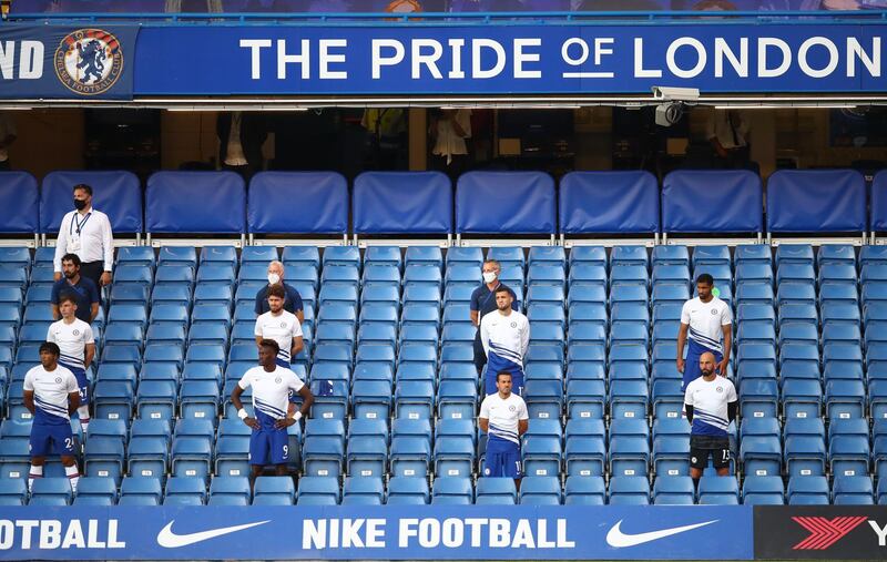 Chelsea substitutes take the knee before the match. AFP