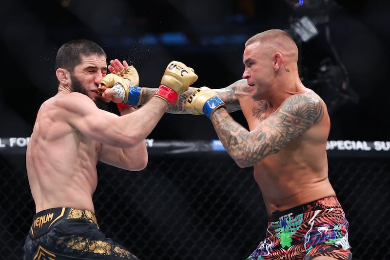 Dustin Poirier lands a punch on Islam Makhachev during their lightweight title bout at UFC 302. AFP