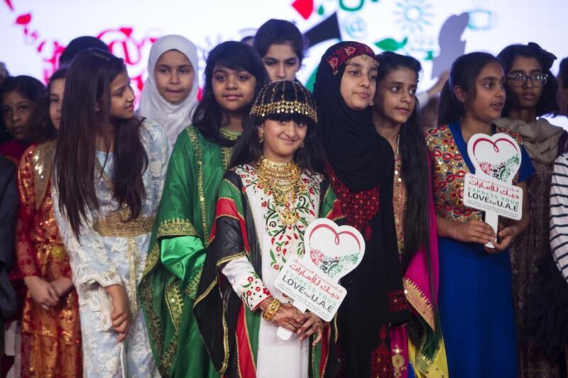 Children dressed in their countries’ national dress at the launch of the I Love UAE initiative, hosted under the patronage of Sheikh Saif bin Zayed, at the Ritz Carlton hotel in Abu Dhabi on Sunday. The campaign leads up to the 45th UAE National Day. Christopher Pike / The National