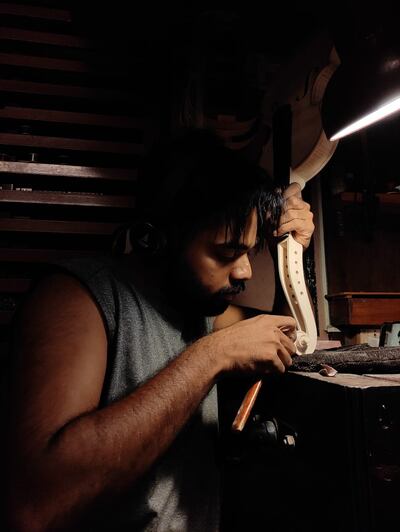 Vinay Murali working on a violin that takes over 300 hours to make. Photo: Vinay Murali