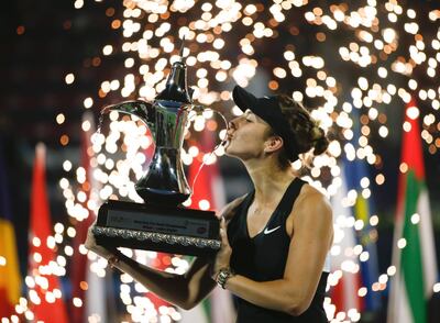 epa07391059 Belinda Bencic of Switzerland celebrates with trophy after winning her final match against Petra Kvitova of the Czech Republic at Dubai Duty Free Tennis WTA Championships 2019 in Dubai, United Arab Emirates, 23 February 2019.  EPA/ALI HAIDER