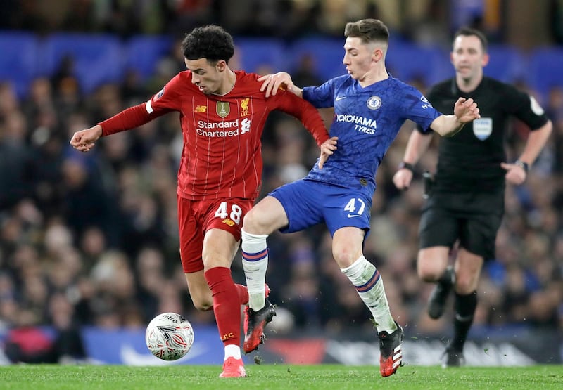 Billy Gilmour battles for the ball with Curtis Jones. AP Photo