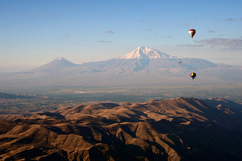 Ballooning enthusiasts near Garni in the Kotayk region of Armenia during the 'Discover Armenia from the Sky' international ballooning festival, with Mount Ararat in the background. Participants from Armenia, Brazil, Bulgaria, Germany, Kazakhstan, Poland and Russia take part in the festival. AFP