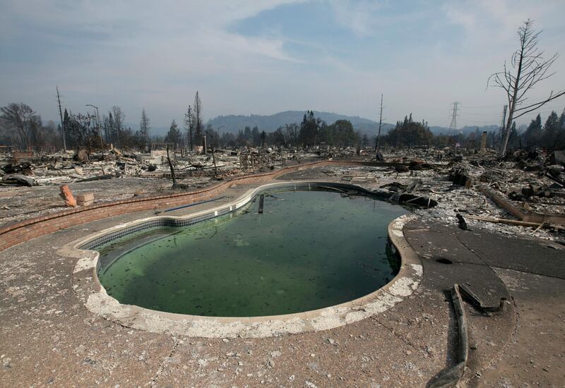 A swimming pool sits among the charred remains of a home in Santa Rosa, California. Rich Pedroncelli / AP Photo