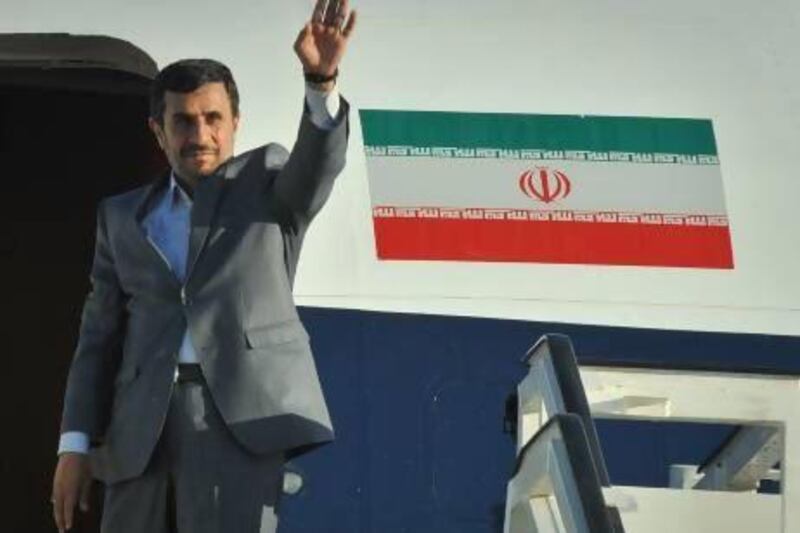 Iranian President Mahmoud Ahmadinejad waves before boarding his plane at Jose Marti airport, on January 12, 2012, upon departure from Cuba after an official visit. Adalberto Roque AFP Photo
