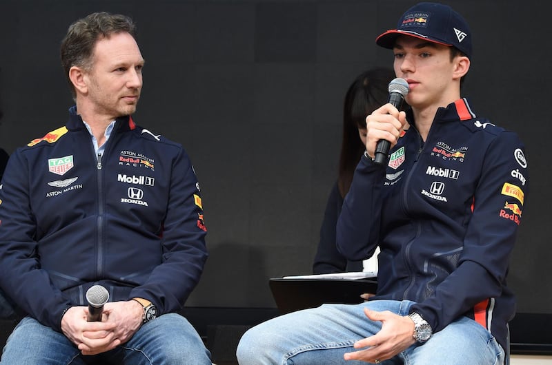 Aston Martin Red Bull Racing driver Pierre Gasly (R) speaks during a talk session for the media at Hononda Motor's headquarters in Tokyo on March 9, 2019 while team principal Christian Horner (L) look on. The season-opening Australian Grand Prix will be held on March 17. / AFP / Kazuhiro NOGI
