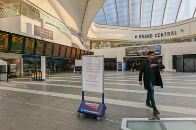 A passenger walks through a near-empty Birmingham New Street station. PA