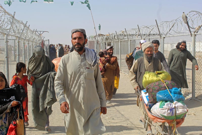 Afghan nationals at the Pakistan-Afghanistan border crossing point in Chaman wait to return to Afghanistan. AFP