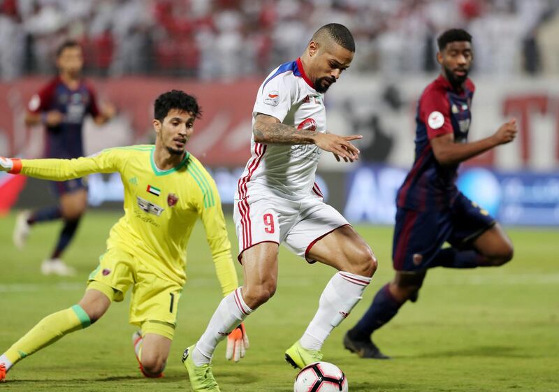Sharjah, United Arab Emirates - May 15, 2019: Football. Sharjah's Welliton Morais scores during the game between Sharjah and Al Wahda in the Arabian Gulf League. Wednesday the 15th of May 2019. Sharjah Football club, Sharjah. Chris Whiteoak / The National