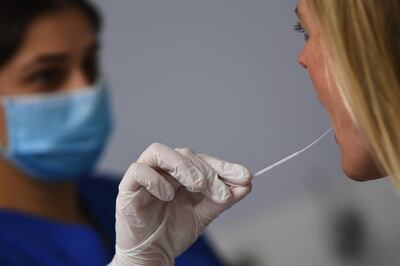 A patient undergoes a Covid-19 swab test at the Robert Bosch Hospital in Stuttgart, Germany, on Tuesday, Sept. 29, 2020. Robert Bosch GmbH developed a new test for its Vivalytic medical device that can detect Covid-19 infections in 39 minutes. Photographer: Andreas Gebert/Bloomberg