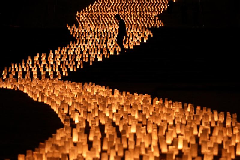 Thousands of candles are arranged in the shape of the Milky Way to celebrate Tanabata, a Japanese star festival, at Zojoji Temple, Tokyo.  AP