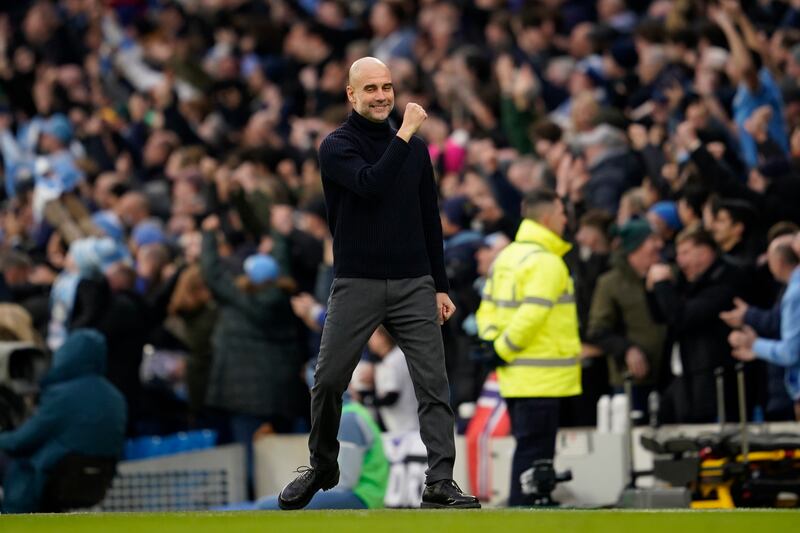 Manchester City manager Pep Guardiola celebrates after Manchester City's Phil Foden scores their second goal. AP 