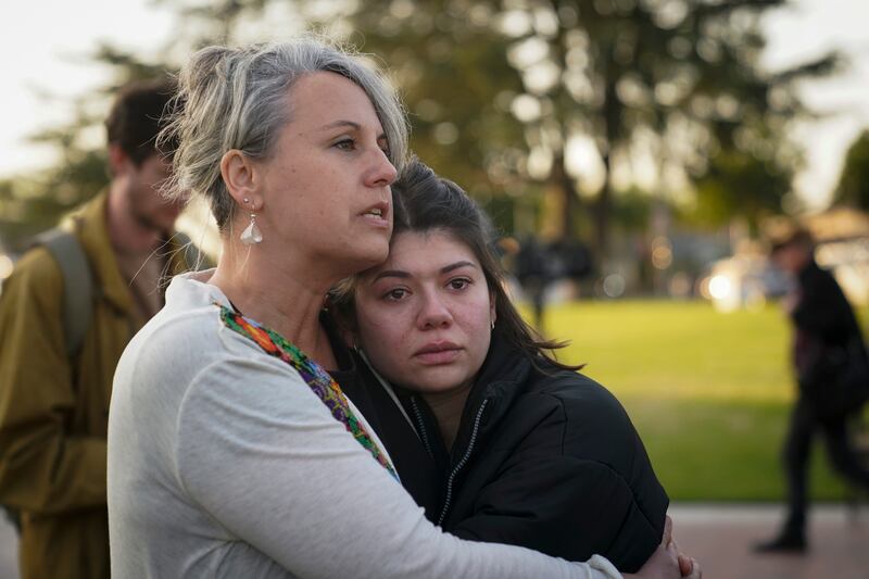 Jolie Slater, right, and Beth Paz, from Lake Avenue Church, embrace each other at a gathering held to honor the victims. AP