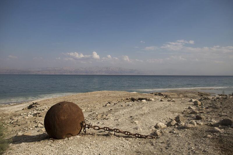 An old buoy used by the Israeli navy when they were stationed at the Dead Sea during the 1980s lies about 20 meters out of the water and marks were the water line was about 30 years ago.