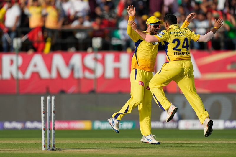 Chennai Super Kings' Tushar Deshpande and teammate Sameer Rizvi celebrate the wicket of Punjab Kings batter Rilee Rossouw who was out for a duck. AP