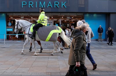 A mounted police officer is seen riding past a Primark store in Newcastle city centre, after new nationwide restrictions were announced during the coronavirus disease (COVID-19) outbreak in Newcastle upon Tyne, Britain, November 4, 2020. REUTERS/Lee Smith