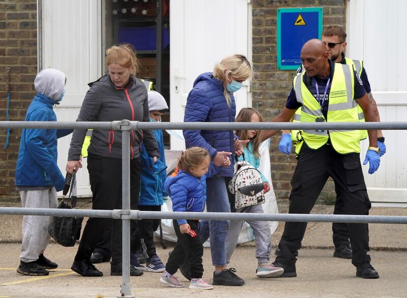 Young children are taken into Dover on June 21, 2022. PA