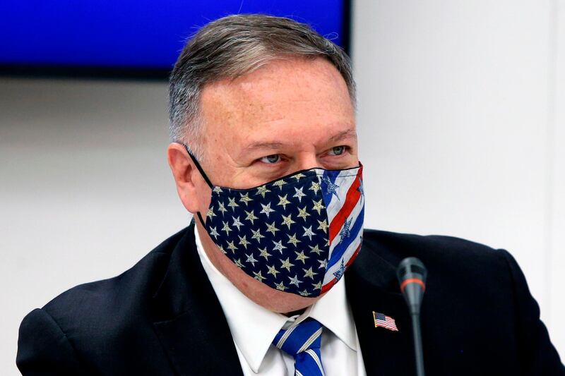 US Secretary of State Mike Pompeo wearing a mask attends a signing agreement ceremony in the northern city of Thessaloniki, on September 28, 2020.  US Secretary of State began talks on September 28 in Greece to de-escalate tension in the eastern Mediterranean and boost tentative steps at dialogue between Athens and Ankara. / AFP / POOL / Giannis Papanikos
