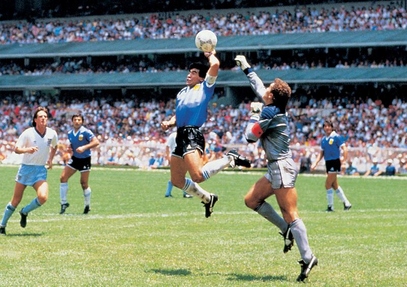 Diego Maradona scoring the legendary 'Hand of God' goal.  Photo: Giuliano Bevilacqua