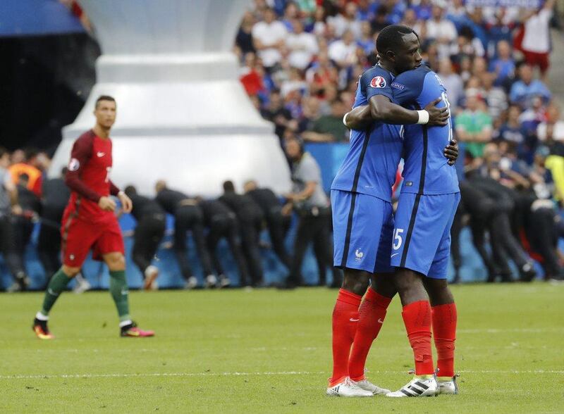 Moussa Sissoko of France (L) and Paul Pogba of France hug prior the Uefa Euro 2016 Final match between Portugal and France at Stade de France in Saint-Denis, France, 10 July 2016. Etienne Laurent / EPA