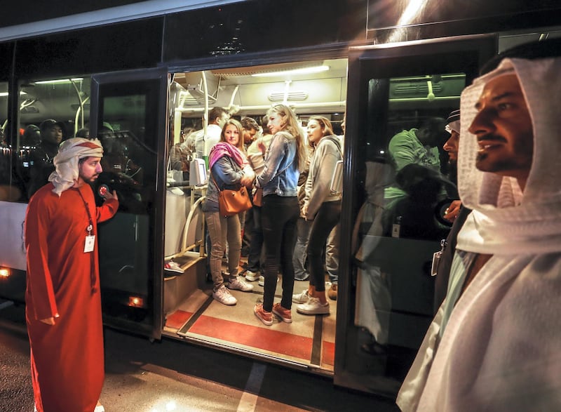 Abu Dhabi, U.A.E., February 5, 2019.   Worshipers heading onto buses at Nation Towers before they're transported to the mass.  RTA employees busy helping worshipers board the shuttles to the mass.
Victor Besa/The National
Section:  NA
Reporter:
