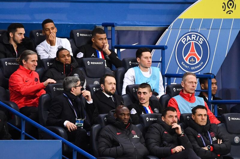 Kylian Mbappe, back row right, after being substituted. AFP