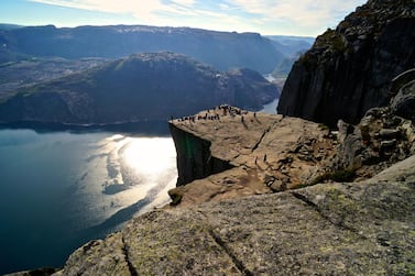 Travellers atop Norway's Pulpit Rock. Courtesy Andreas Gruhle / visitnorway.com / Innovation Norway